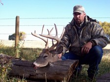 Brad Gill shown here with a picture of a whitetail buck that was taken by one of his 2008 clients.