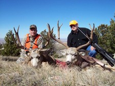 Ed O. and John H. show off their 2006 trophy mule deer bucks.  Both of these bucks were taken during the mid October deer hunting season.