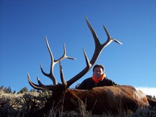 Mark Nethery shown here with his trophy 6x7 bull elk taken early on the first morning of his hunt.