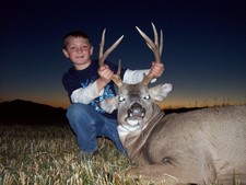 Colter Nunn shown here with a nice whitetail buck that he helped his dad get one evening after school.