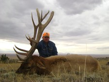 Chad Justus shown here with his 2010 trophy bull elk.  Chad is the 